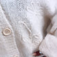 HERA Strick Cardigan mit verspielter Blume / wollweiss - weiss Art. 6547